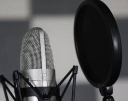 Close up picture of microphone and pop filter